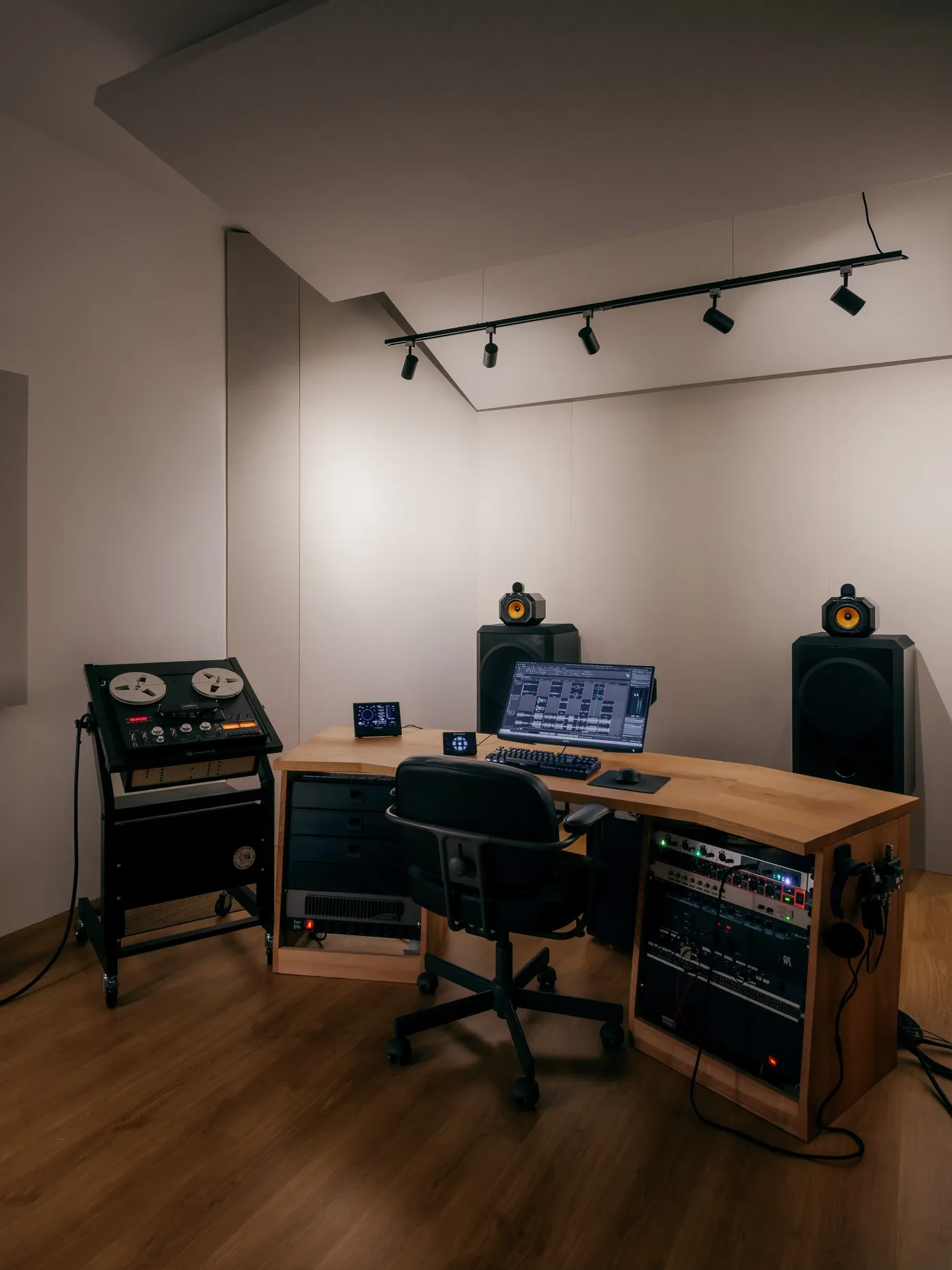 Qualia Audio Lab mastering room with B&W 801 monitors, desk and reel-to-reel machine